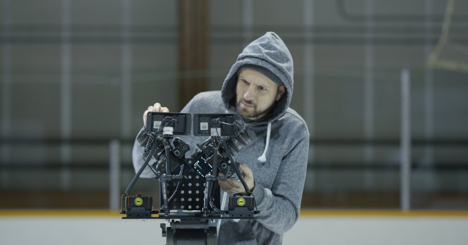 The rig being operated hand-held on a hockey rink